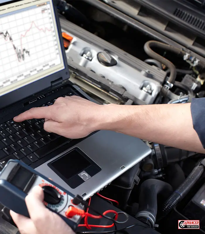 ASE auto service technician working on vehicle