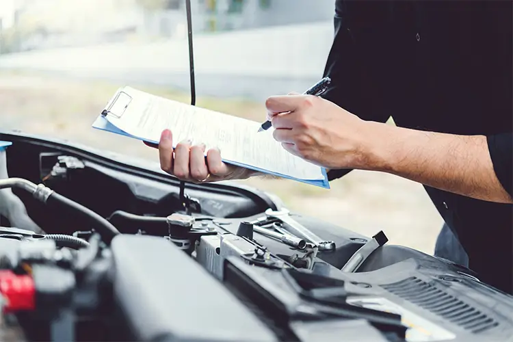 Engine Tech Inspecting Engine Bay