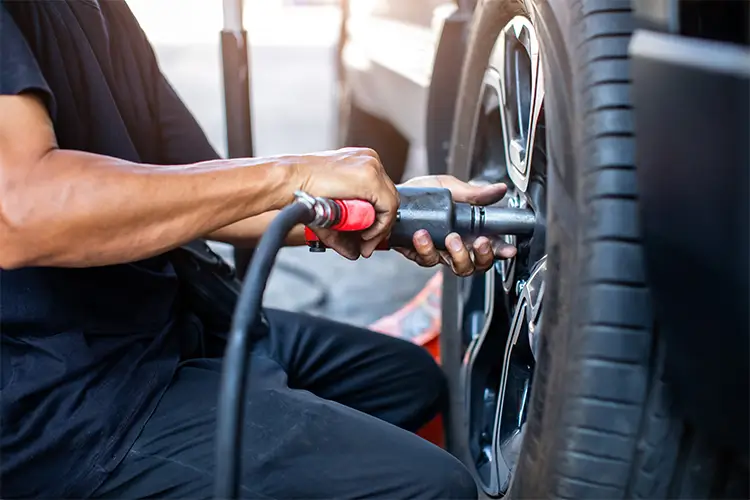 Tire Expert Working on Vehicle