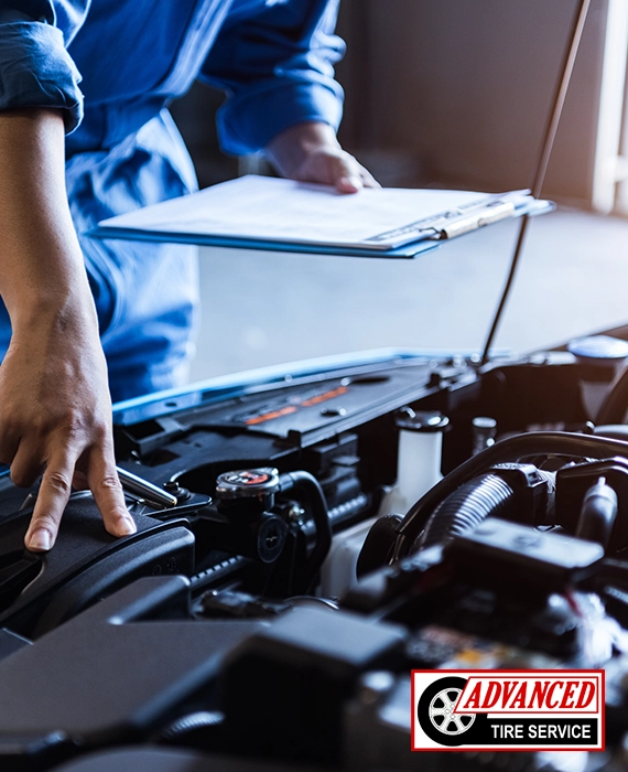 Auto technician performing an oil change service